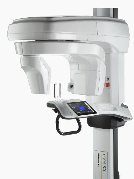Carestream CS 9600 extraoral 3D dental imaging system featuring an integrated touchscreen interface and positioning support.